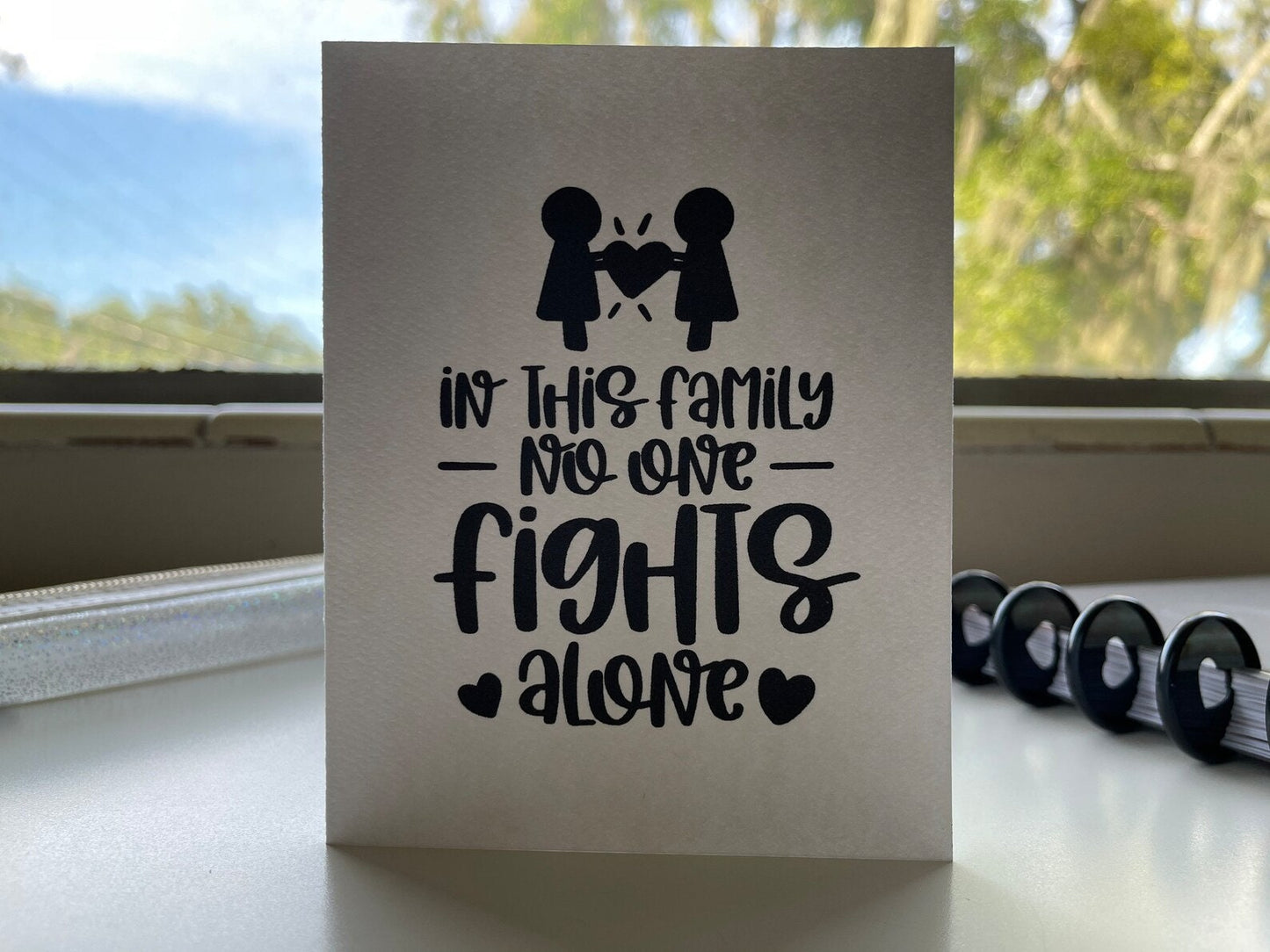 Card "In this family no one fights alone"